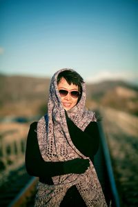 Portrait of young woman wearing sunglasses