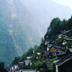 Panoramic view of village against mountains