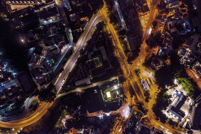 High angle view of city lit up at night