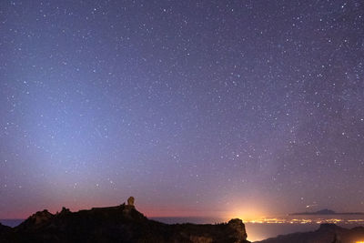 Low angle view of star field against sky at night