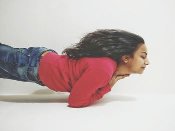 Young woman over white background