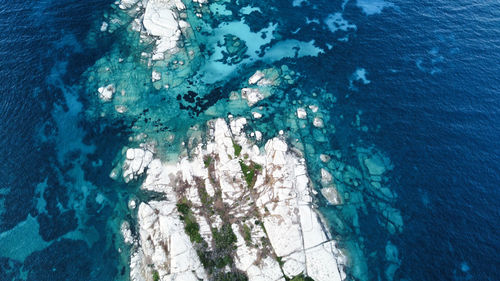 Rocky island surrounded by clear deep blue waters in santa teresa di gallura, sardinia, italy 