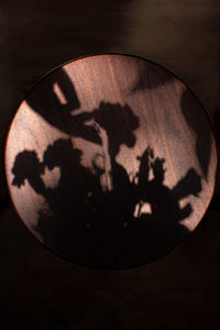 Close-up of cake on table against black background