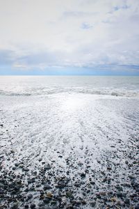 Scenic view of sea against sky during winter