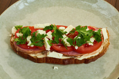 High angle view of pizza in plate on table