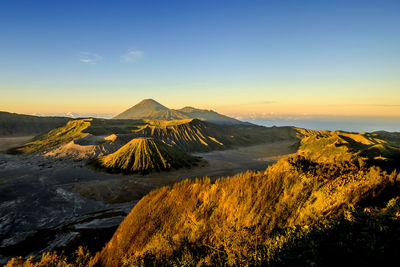 Scenic view of snowcapped mountain against sky during sunset