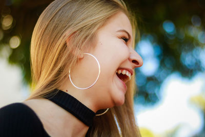 Close-up of cheerful beautiful woman