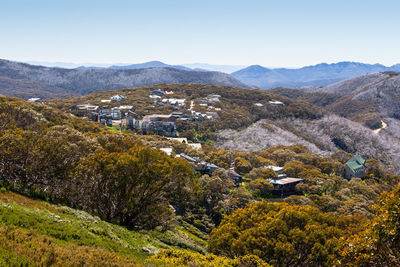 Scenic view of landscape and buildings against sky