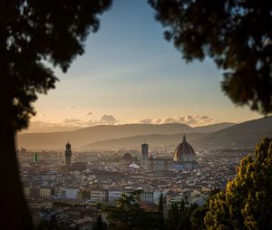 Cityscape against sky during sunset