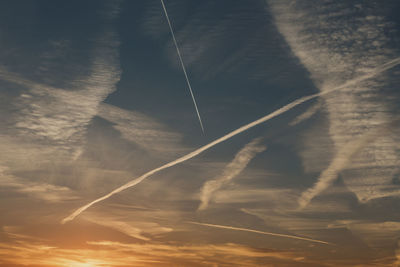Low angle view of vapor trails in sky