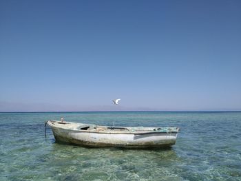 Boat in sea against clear sky