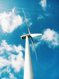 Low angle view of windmill against sky