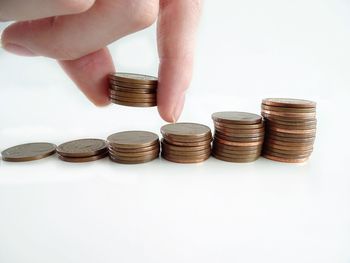 Close-up of hand holding coins