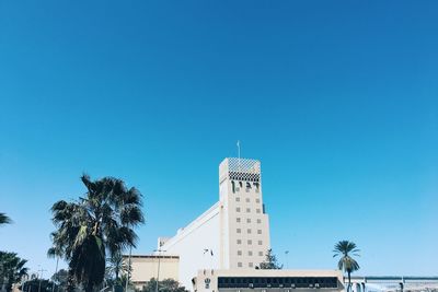 Low angle view of built structure against clear blue sky