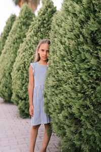 Candid caucasian happy little kid girl of eight years old with long blond hair and green eyes