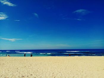 View of beach against blue sky