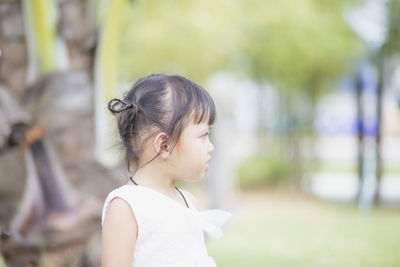 Side view of young woman looking away