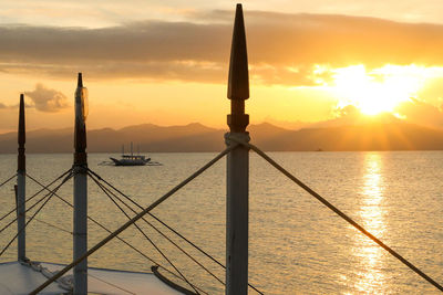 Scenic view of sea against orange sky