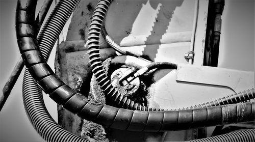 High angle view of pipes on metal grate