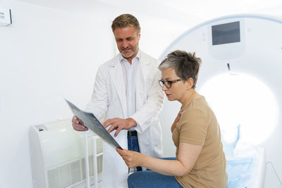 Female doctor examining patient in hospital