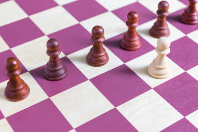 Close-up of chess pieces on board