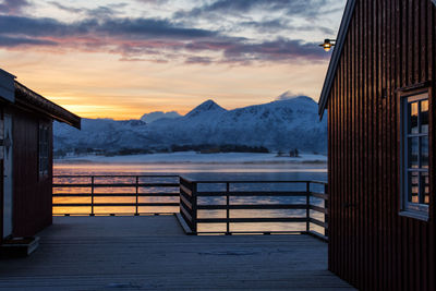 Scenic view of snowcapped mountains against sky during sunset