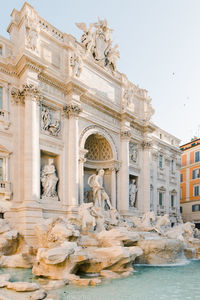 Statue of historic building against sky