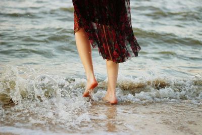 Low section of woman on beach