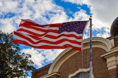 Low angle view of flag against sky