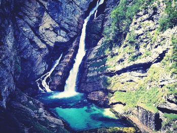 Scenic view of river amidst mountains