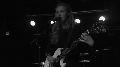 People playing guitar at night