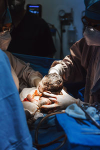 New born latin baby in doctor's hands in a mexican hospital in mexico city