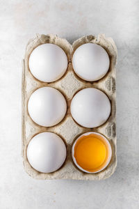 Directly above shot of eggs in carton on table