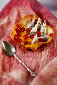 Close-up of appetizer with spoon on napkin