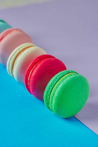 High angle view of multi colored pills against blue background