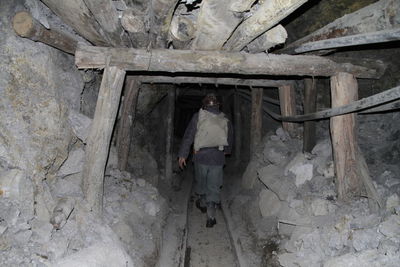 Full length of man standing in abandoned building