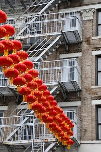 Low angle view of lanterns hanging on building