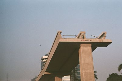 Low angle view of communications tower against sky