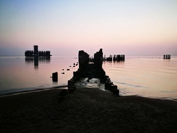 Scenic view of sea against clear sky during sunset