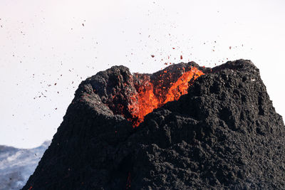 Scenic view of volcanic mountain against sky