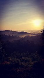 Scenic view of silhouette landscape against sky during sunset