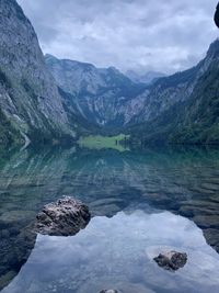 Scenic view of lake and mountains against sky