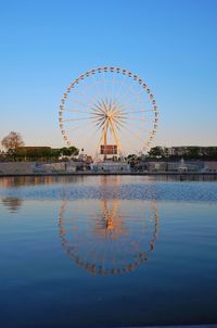 Ferris wheel against clear blue sky