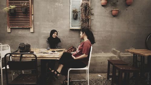 Woman sitting in restaurant