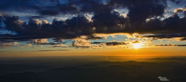 Scenic view of dramatic sky during sunset