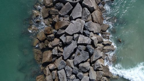 High angle view of rocks in sea
