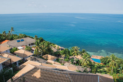 High angle view of swimming pool by sea against sky