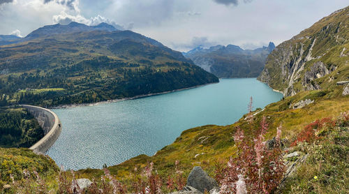 Scenic view of lake and mountains against sky