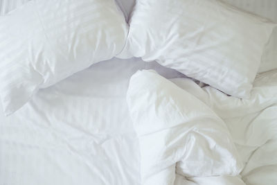 Close-up of white bed