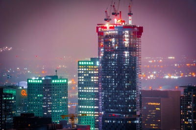 Illuminated buildings in city at night